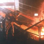 Worker in protective gear at foundry