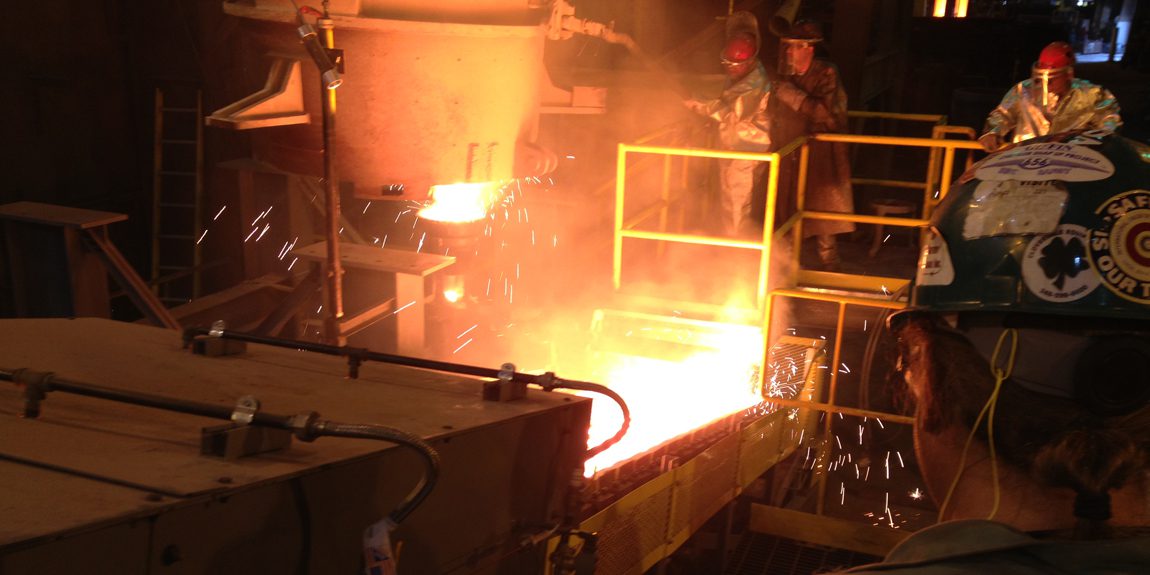 Industrial foundry with glowing molten metal
