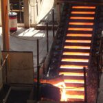 Hot metal slabs in production line