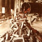 Industrial conveyor releasing wooden planks