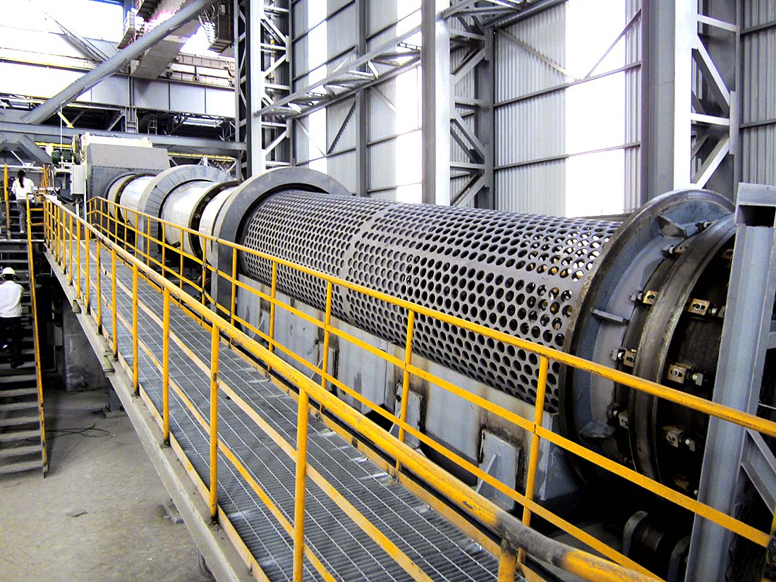 Large metal cylinder in factory setting