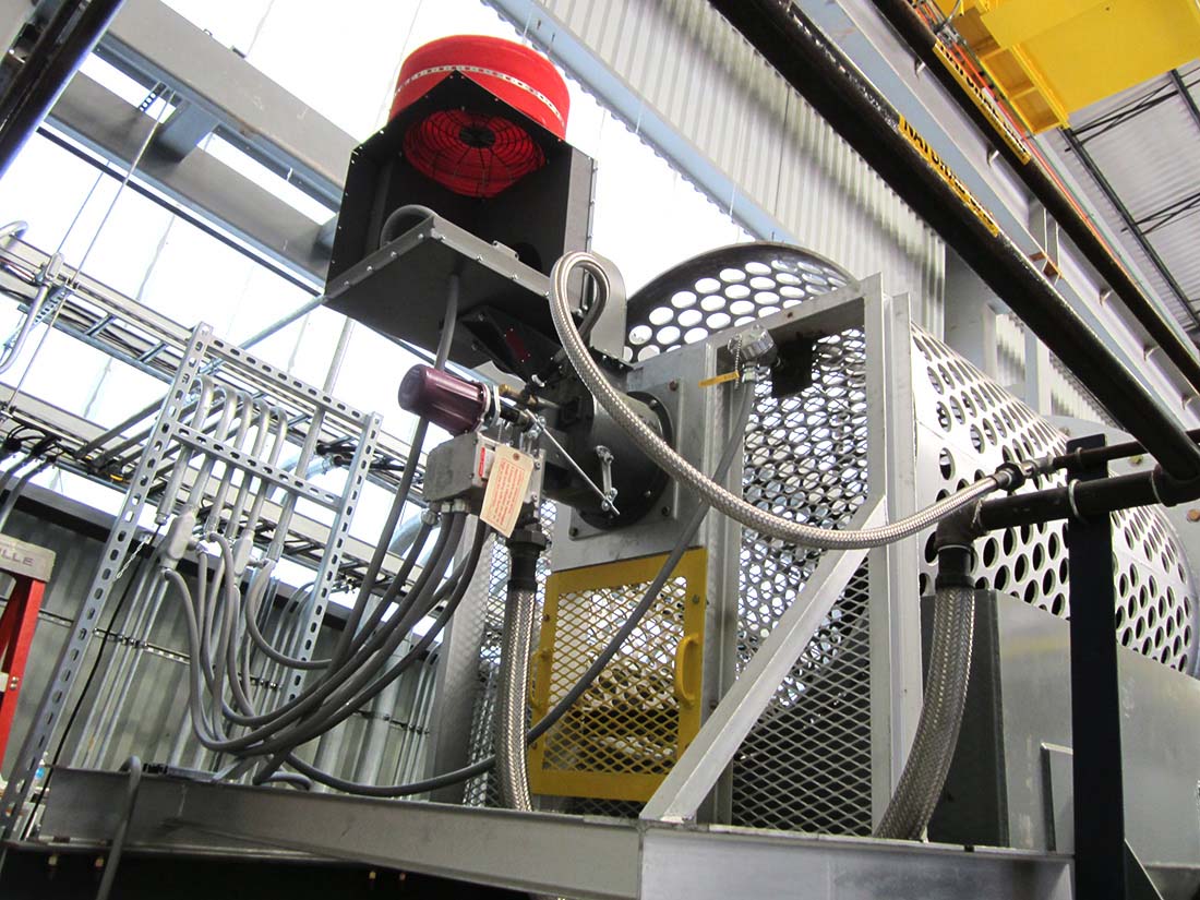 Machinery with perforated metal housing.